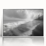 Framed acrylic wall art featuring a serene landscape with a lighthouse, set against a vibrant sunset sky, perfect for coastal-themed home decor.