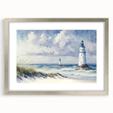 Framed silver wall art featuring a serene lighthouse landscape design, complete with a white mat, ideal for coastal-themed decor in homes or offices.