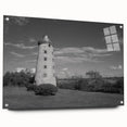Acrylic glass wall art showcasing a serene lighthouse landscape design, viewed from the side, elegantly mounted with pins, perfect for coastal-themed decor.