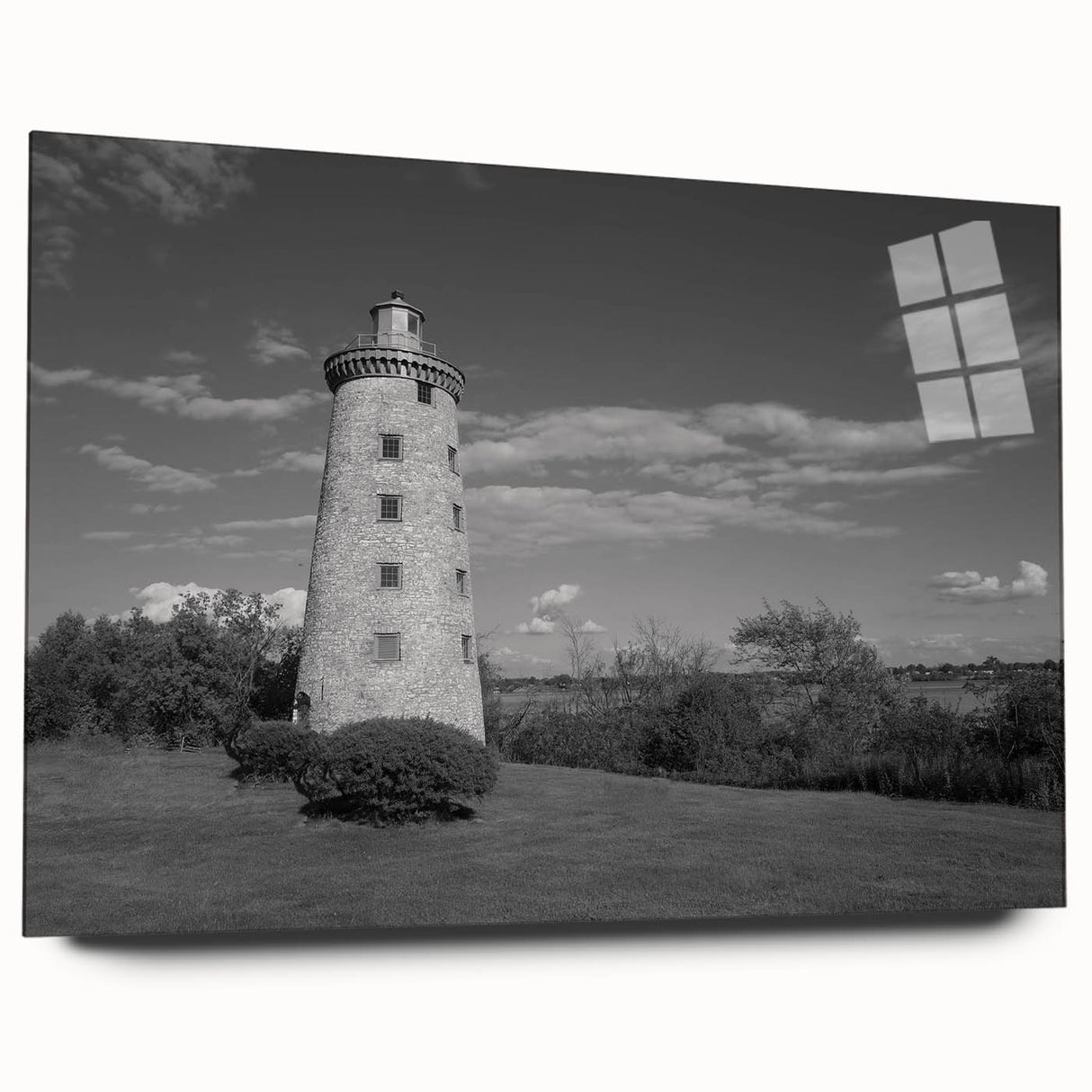 Acrylic glass wall art showcasing a stunning landscape design featuring a lighthouse, presented from a side view, perfect for enhancing home decor with coastal charm.