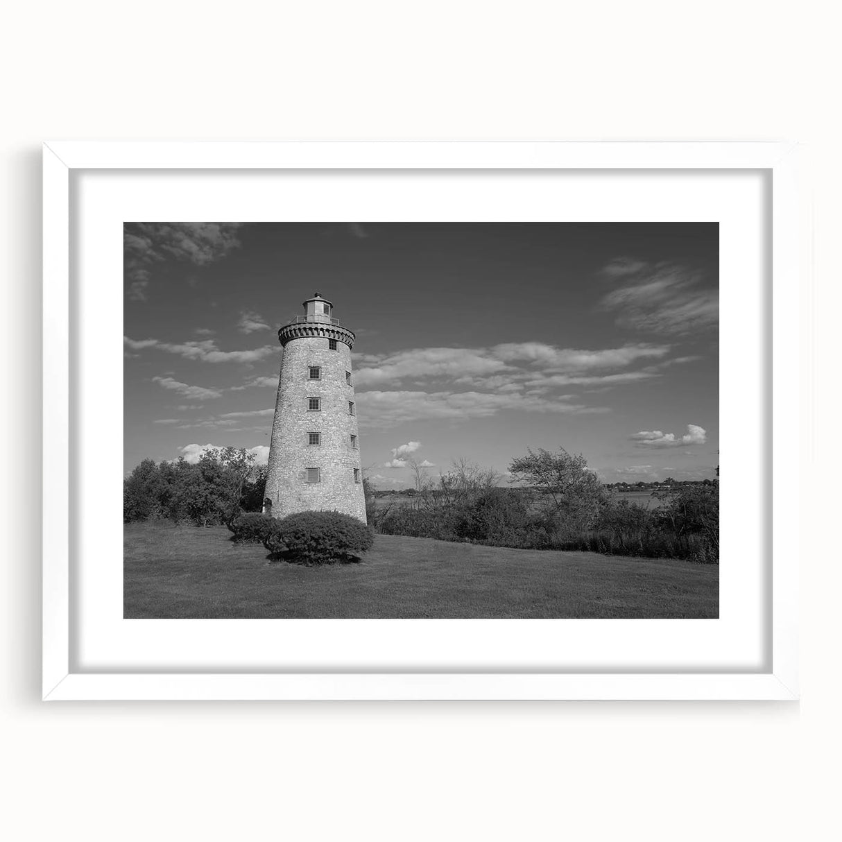 Framed wall art collection showcasing a serene lighthouse landscape design with a white mat, perfect for coastal-themed home decor. Ideal for enhancing living spaces.