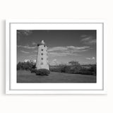 Framed wall art collection showcasing a serene lighthouse landscape design with a white mat, perfect for coastal-themed home decor. Ideal for enhancing living spaces.