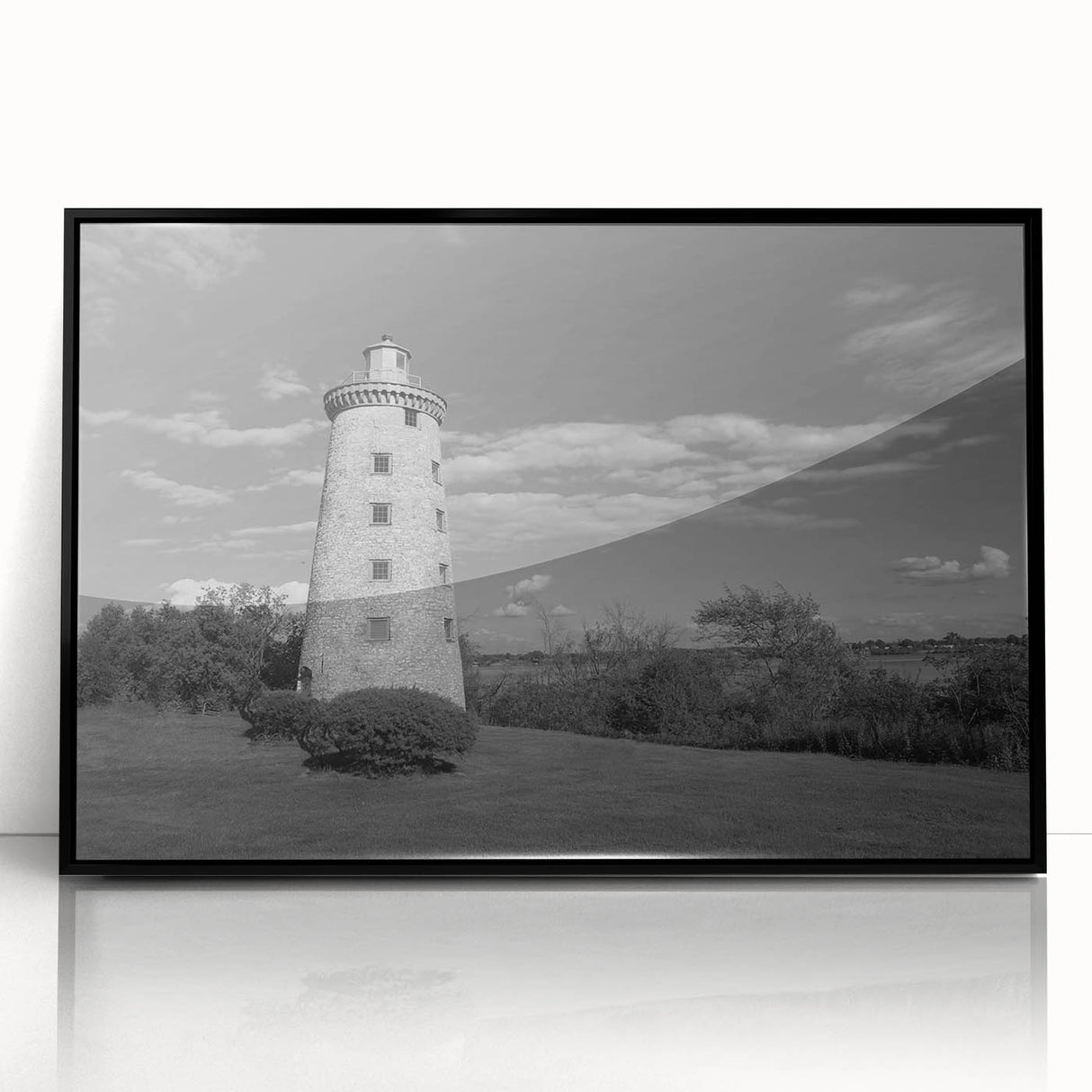 Framed wall art featuring a coastal lighthouse design in vibrant colors, showcasing a serene seascape with blue skies and waves, perfect for home decor.