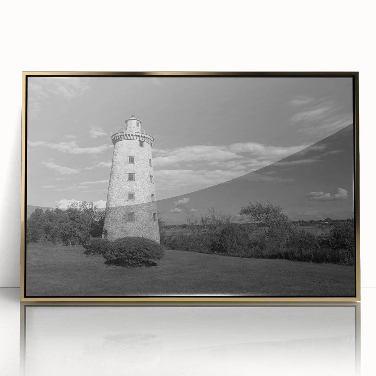 Framed wall art depicting a scenic lighthouse design with vibrant colors, acrylic glass front, and gold accents, ideal for coastal home decor.