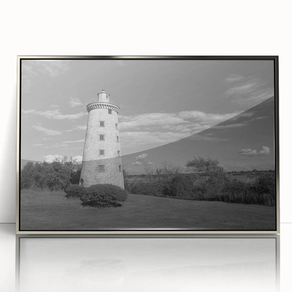 Framed acrylic wall art featuring a serene lighthouse design, showcasing vibrant coastal colors and intricate details, perfect for enhancing home decor.