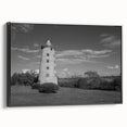 Framed canvas wall art featuring a scenic lighthouse design with vibrant colors, black frame, and side view showcasing the artwork's depth and texture, ideal for home decor.