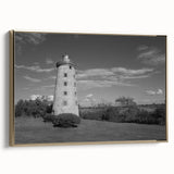 Framed canvas wall art showcasing a stunning lighthouse design with gold accents, set against a serene landscape background, ideal for coastal decor enthusiasts.