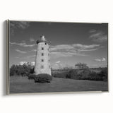 Framed canvas wall art featuring a silver-framed lighthouse design against a sunset backdrop, showcasing vibrant colors and serene coastal imagery, perfect for home decor.