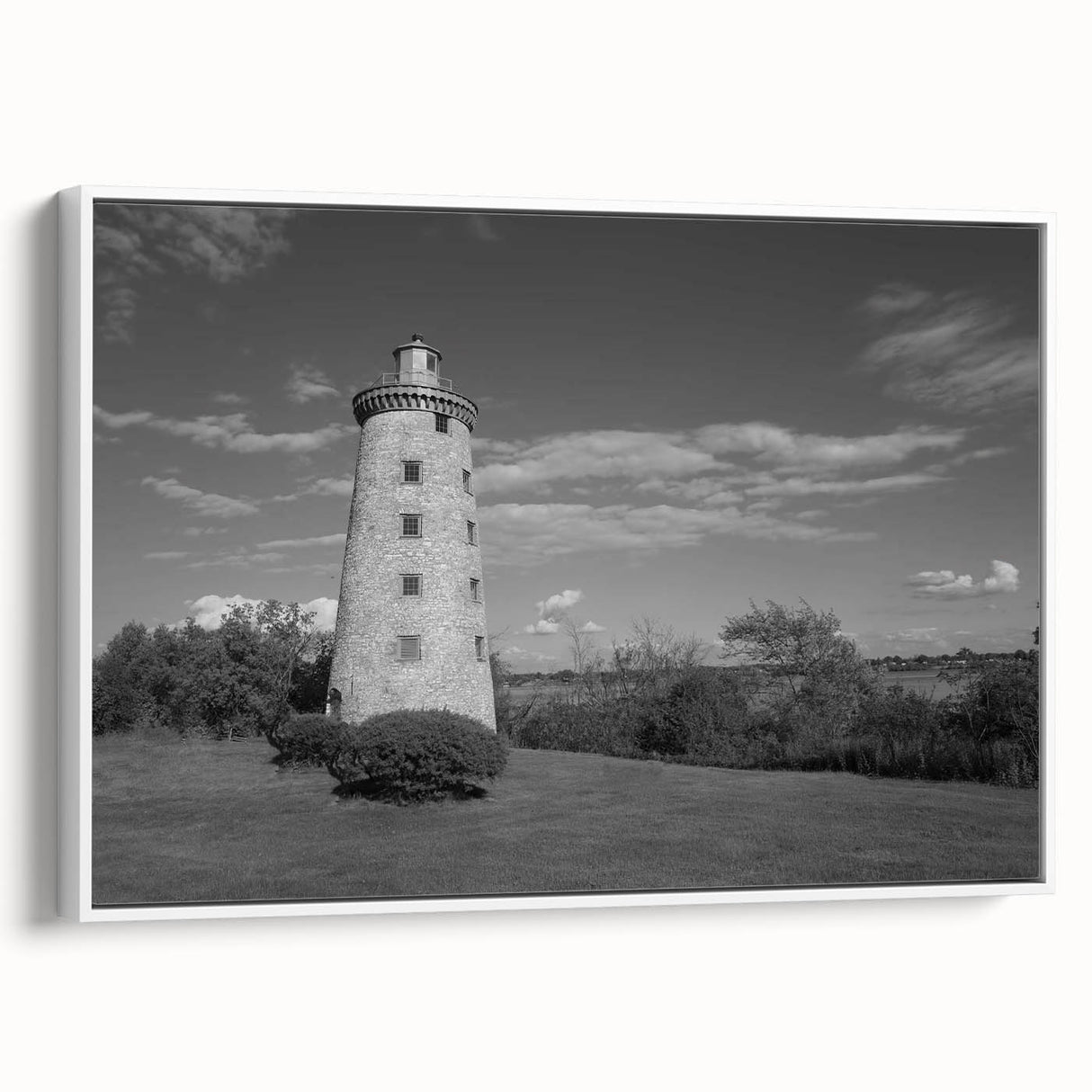 Framed canvas wall art showcasing a serene lighthouse design against a vibrant sunset, perfect for coastal-themed decor, enhancing home aesthetics.