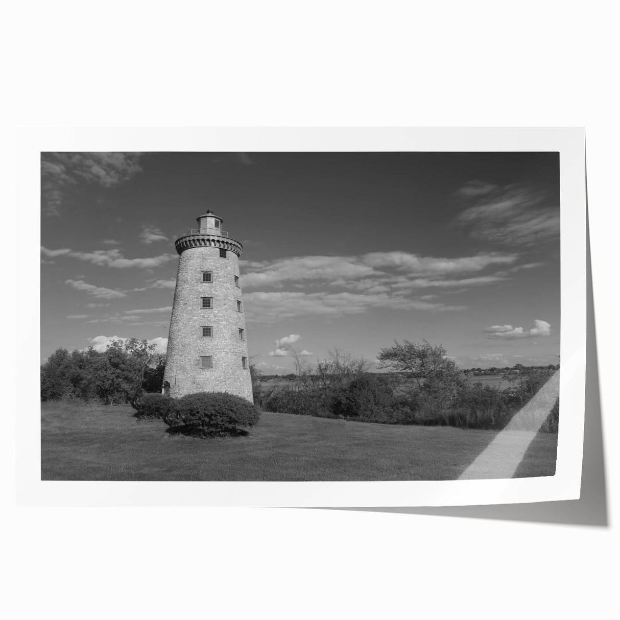 Rolled print featuring a serene lighthouse landscape design, showcasing vibrant colors of the sky and ocean, perfect for coastal home decor. Ideal for enhancing living spaces.