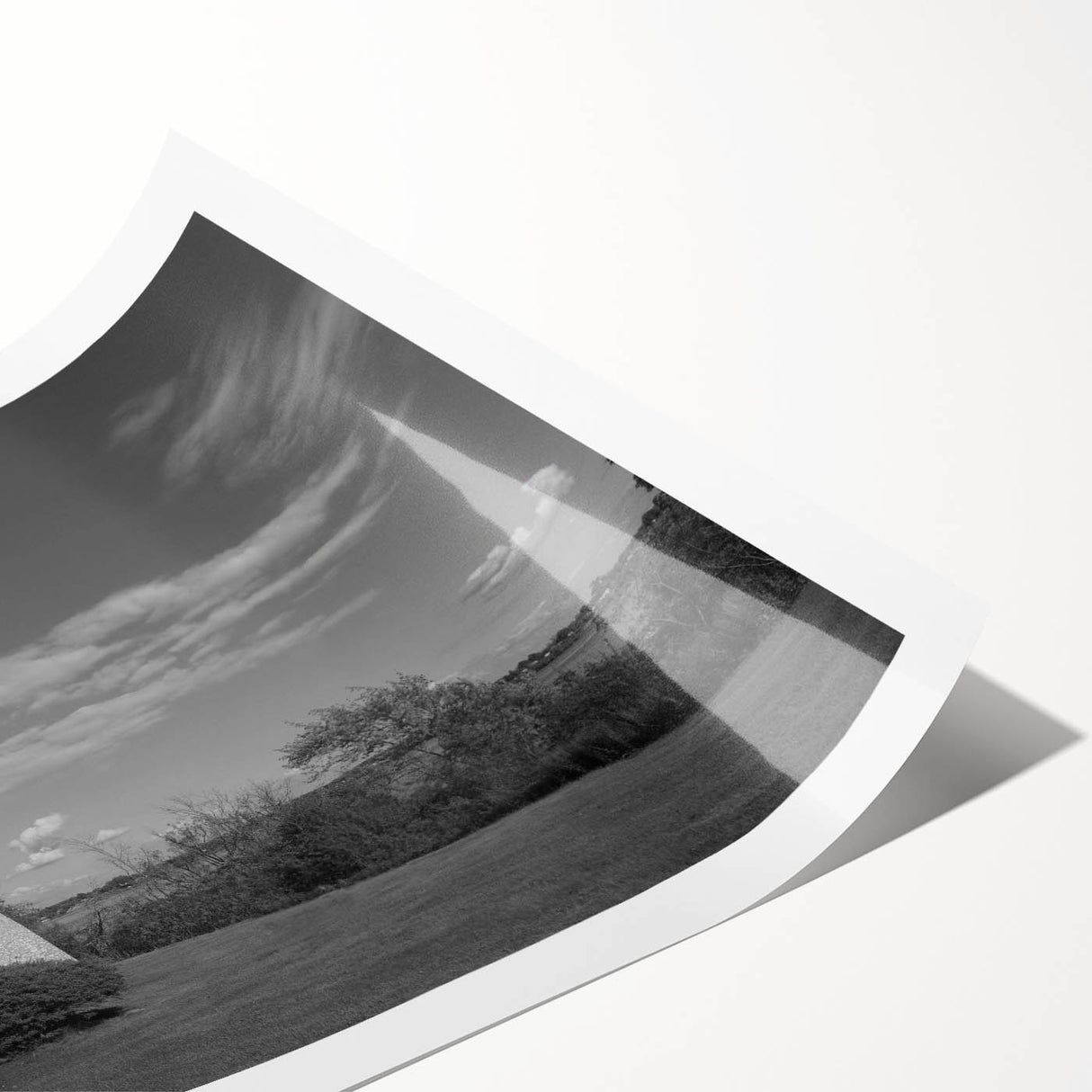 Coastal landscape wall art showcasing a vibrant lighthouse scene with waves crashing against rocks, mounted on a rolled canvas for easy framing and display.
