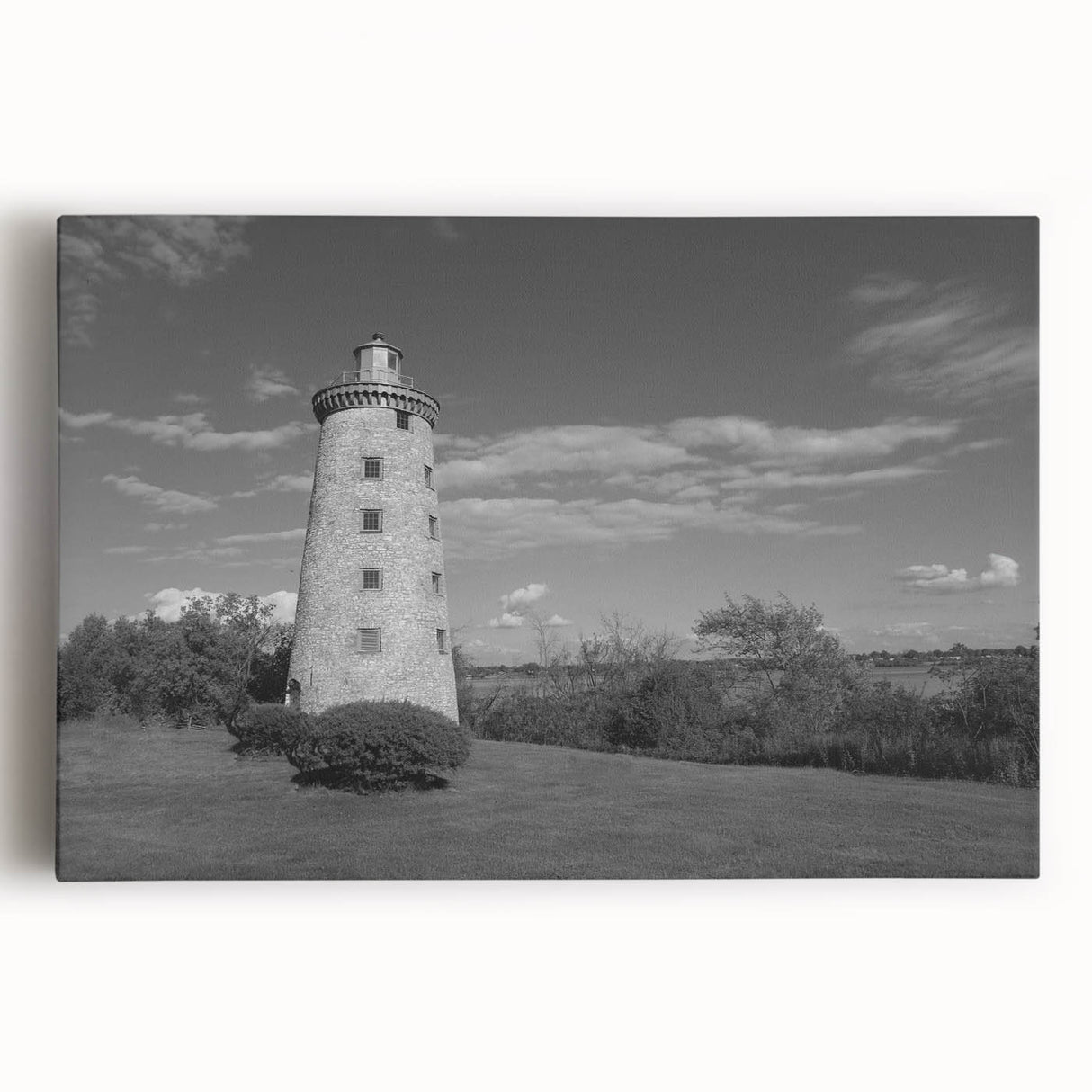 Stretched canvas wall art showcasing a vibrant lighthouse design with serene ocean waves, perfect for coastal-themed decor. Ideal for adding tranquility to any room.