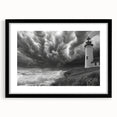 Framed wall art featuring a serene lighthouse landscape design, showcased in a sleek black frame with a mat, perfect for coastal decor enthusiasts. This elegant piece adds a calming touch to any home or office space.