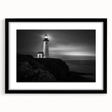 Framed wall art featuring a lighthouse design in a black frame with a mat, showcasing vibrant colors and intricate details, perfect for coastal-themed decor.