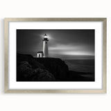 Framed silver wall art showcasing a scenic lighthouse design, complete with a white mat, perfect for coastal-themed home decor. Ideal for modern interiors.