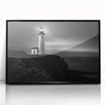 Framed wall art featuring a coastal landscape with a lighthouse, set against a vibrant sunset, highlighted by black acrylic framing, perfect for home decor.