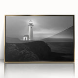Framed wall art of a scenic lighthouse design with golden accents, showcasing a tranquil coastal landscape, perfect for home decor.