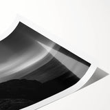 Vibrant rolled print of a lighthouse landscape, showcasing a serene coastal scene with vivid blue skies and crashing waves, perfect for home decor.