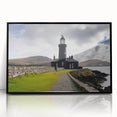 Framed wall art showcasing a serene lighthouse design set against a vibrant sunset, featuring black framing and acrylic glass for a modern touch. Ideal for coastal-themed decor.