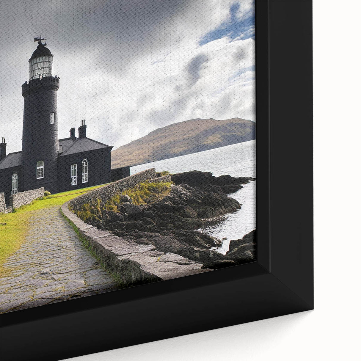Framed canvas artwork depicting a serene lighthouse landscape, with vibrant colors and intricate details, perfect for home decor and coastal-themed settings.
