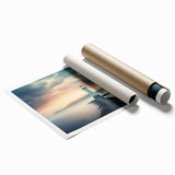 Colorful landscape wall art showcasing a lighthouse against a vibrant sunset, rolled and ready for display, ideal for coastal-themed decor. Perfect for adding warmth and character to any room.