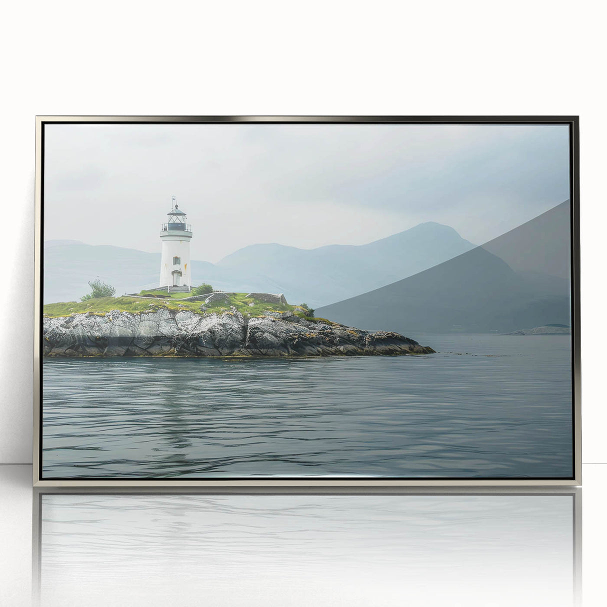 Framed acrylic wall art showcasing a serene lighthouse design amidst a coastal landscape, featuring a silver frame that enhances its elegance, perfect for home decor.