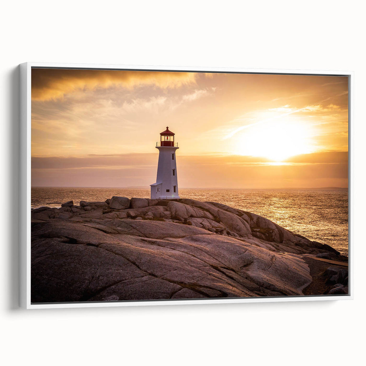 Framed canvas wall art showcasing a serene lighthouse landscape design with soft blue and white hues, perfect for coastal-themed decor in living spaces.