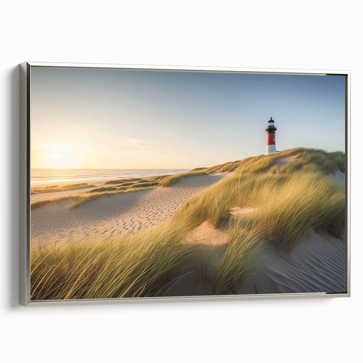 Framed canvas wall art featuring a serene lighthouse landscape design, with a silver frame enhancing the coastal scene’s calming blues and greens, perfect for home decor.