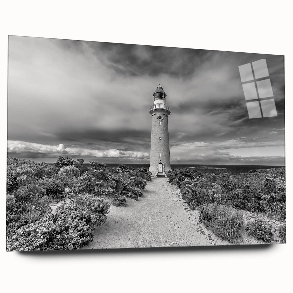 Acrylic glass wall art collection showcasing a scenic lighthouse design, with vibrant colors and intricate details, displayed in a side view without pins, perfect for coastal decor.