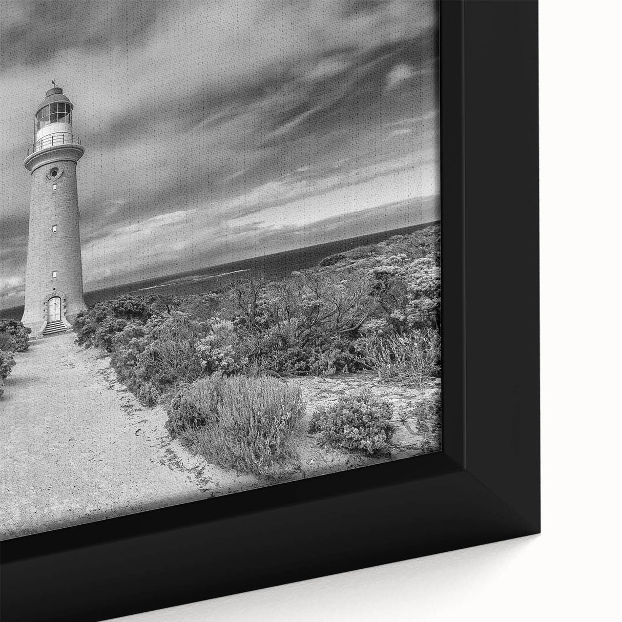 Framed canvas close-up showcasing a serene landscape with a lighthouse, featuring vibrant colors and fine details, perfect for home decor and coastal themes.