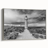 Framed canvas wall art collection showcasing a serene lighthouse landscape design, featuring a silver frame and vibrant colors, perfect for coastal-themed decor.