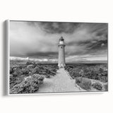 Framed canvas wall art collection featuring a serene lighthouse landscape design in soft pastel colors, showcasing a white frame and side view perspective, perfect for coastal-themed decor.