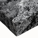 Close-up of a vibrant stretched canvas artwork depicting a picturesque lighthouse surrounded by serene landscapes, showcasing rich colors and intricate details perfect for home decor.