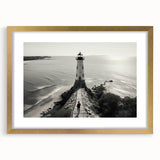 Framed wall art collection featuring a serene lighthouse landscape design with a gold mat and frame, ideal for enhancing living spaces with coastal décor.