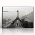 Framed wall art collection showcasing a vibrant lighthouse design, featuring a sleek black frame and acrylic front, perfect for coastal home decor.