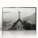 Framed acrylic wall art display featuring a serene seaside landscape with a lighthouse, accented by silver framing, ideal for modern home decor and coastal themes.