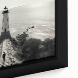 Framed canvas artwork showcasing a close-up of a colorful lighthouse landscape design, featuring vibrant blues and warm tones, perfect for coastal-themed decor.