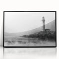 Framed acrylic wall art showcasing a vibrant lighthouse design against a serene landscape, with a sleek black frame enhancing its modern aesthetic. Perfect for coastal-themed decor, this piece adds warmth and inspiration to any room.