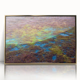 Framed wall art of a serene marsh landscape showcasing lush greenery and reflective water, accented with a gold frame, ideal for home decor.