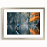 Framed wall art showcasing a serene marsh landscape with vibrant greens and blues, accented by a silver frame and mat, perfect for home decor.