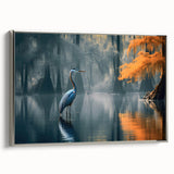 Framed canvas wall art showcasing a serene marsh landscape with lush greenery and tranquil water reflections, highlighted by a silver frame. Perfect for nature-inspired decor.