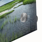 Close-up view of a vibrant acrylic glass artwork showcasing a serene marsh landscape with lush greenery and reflective water, ideal for home decor.