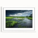Framed wall art showcasing a serene marsh landscape with lush greenery and soft blue hues, featuring a white mat and elegant frame, perfect for home decor.