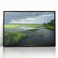 Framed acrylic wall art featuring a serene marsh landscape with lush greenery and soft reflections on water, presented in a sleek black frame. Ideal for nature enthusiasts.