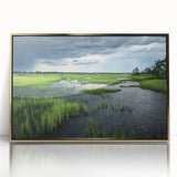 Framed acrylic wall art depicting a serene marsh landscape with vibrant greens and reflective water, accented by a gold frame, ideal for nature enthusiasts.