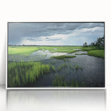 Framed acrylic wall art showcasing a serene marsh landscape with lush greenery and reflections in water, designed for tranquil home decor.