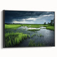 Framed canvas wall art featuring a serene marsh landscape design with lush greenery and tranquil water reflections, set against a black frame for modern decor.
