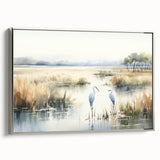 Framed canvas wall art showcasing a serene marsh landscape with vibrant greenery and reflective water, elegantly bordered in silver, perfect for home decor.