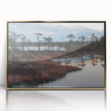 Framed wall art featuring a serene marsh landscape with lush greenery and tranquil water, accented by a gold frame for an elegant touch. Perfect for nature-themed decor.