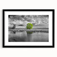 Framed wall art featuring a serene marsh landscape design in a black frame with a mat, highlighting vibrant greens and earthy tones, perfect for home decor.